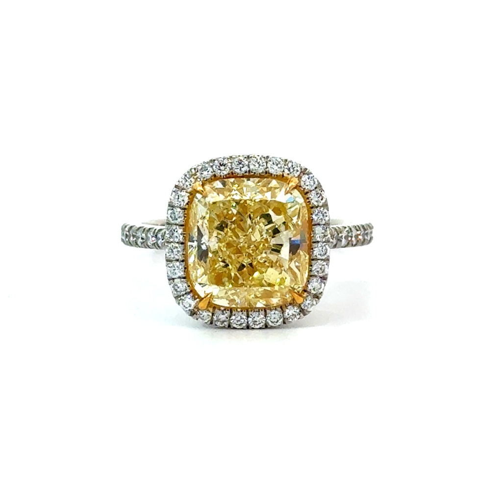Platinum and 18Kt Yellow Gold Halo Ring With A Cushion Cut Yellow Diamond Weighing 4.93ct and Round Diamonds Weighing 0.30ct