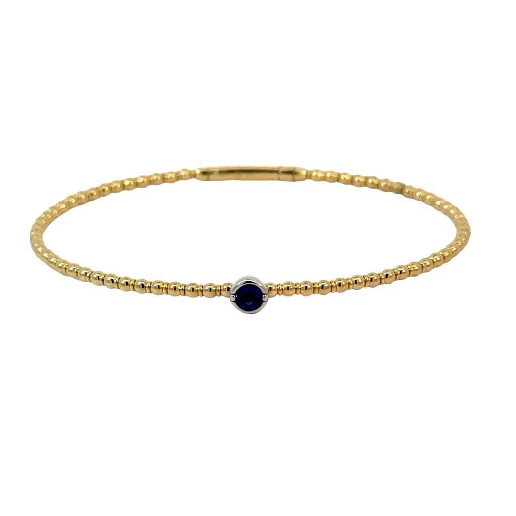 14Kt Yellow Gold Beaded Flex Bangle With A Round Sapphire Weighing 0.24ct
